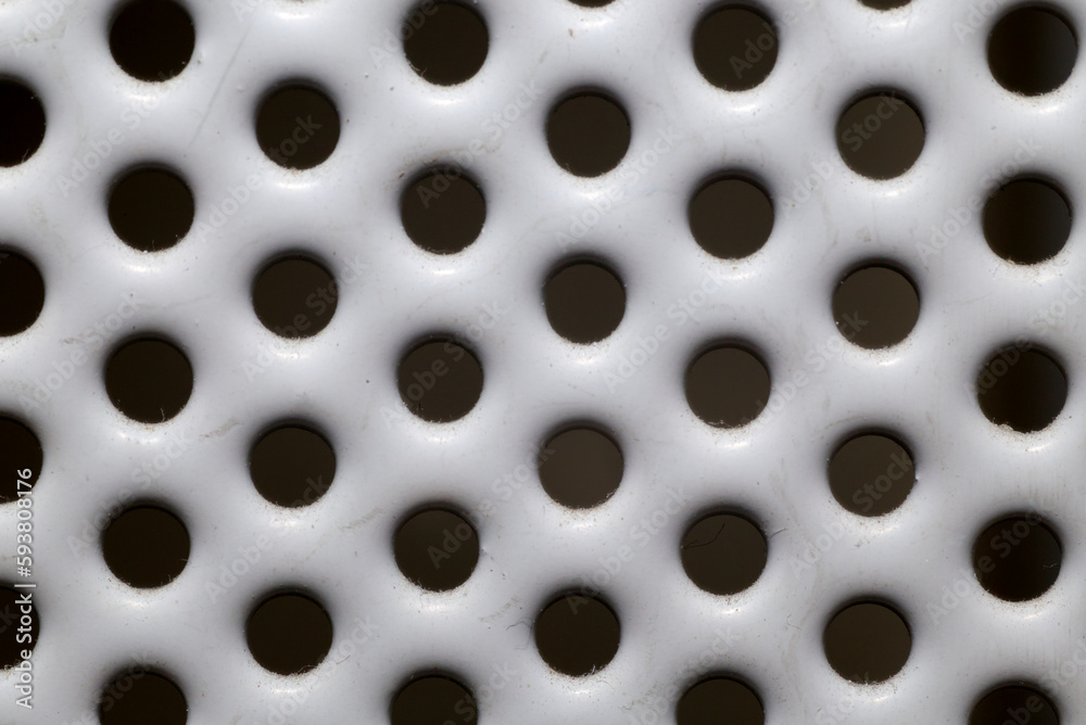 White metal grate with holes White metal grate with holes