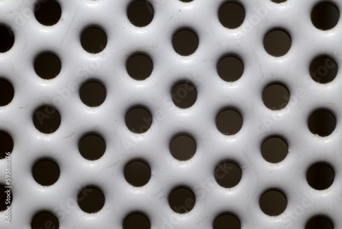 White metal grate with holes