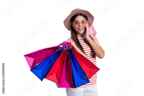 happy shocked teen girl at shopping sale in studio. photo of teen girl at shopping sale with bags.
