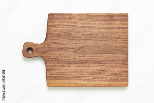 Wooden cutting board. Handmade walnut wood cutting board on white background.