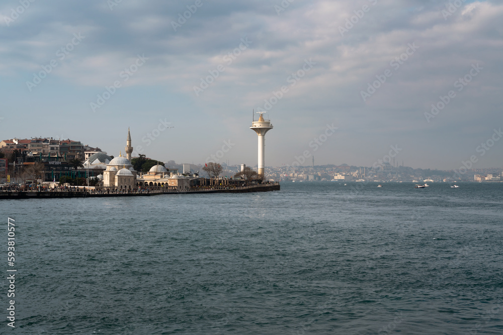 View of the Uskyudar district in the Asian part of Istanbul and the Shemsi Ahmed Pasha Mosque from the Bosporus water area on a sunny day, Istanbul, Turkey View of the Uskyudar district in the Asian part of Istanbul and the Shemsi Ahmed Pasha Mosque from the Bosporus water area on a sunny day, Istanbul, Turkey