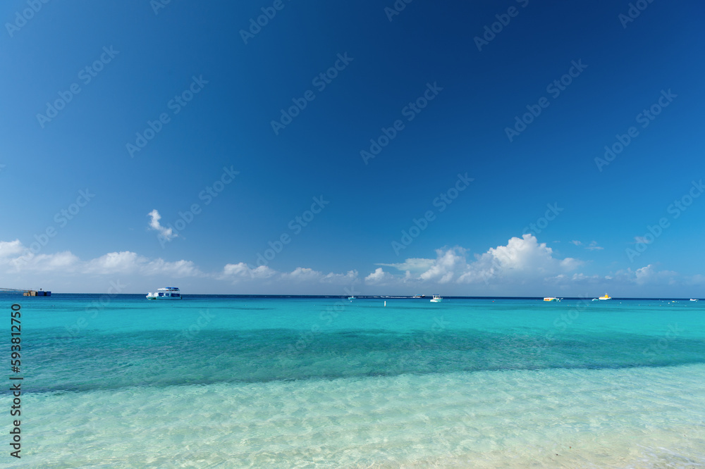 Grand Turk, Turks and Caicos - December 29, 2015: summer seascape with boat in turquoise water