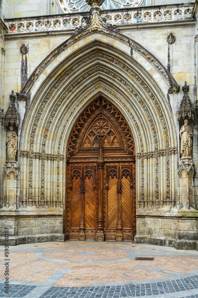 Old wooden entrance door to the church, Bilbao, Spain.