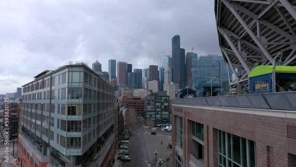 Aerial drone shot flying toward downtown Seattle, Washington skyline on a cloudy day. Aerial drone shot flying toward downtown Seattle, Washington skyline on a cloudy day.