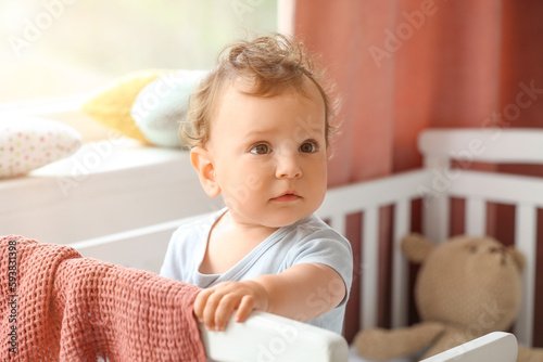 Cute little baby in crib at...