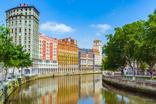 High apartment buildings along the Nervion River, Bilbao, Spain. Nervion river embankment in Bilbao. photo
