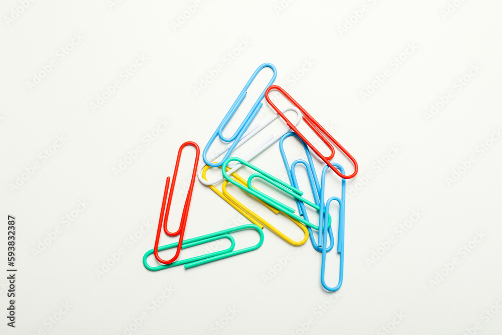 Concept of different office accessories - clips on white background Concept of different office accessories - clips on white background