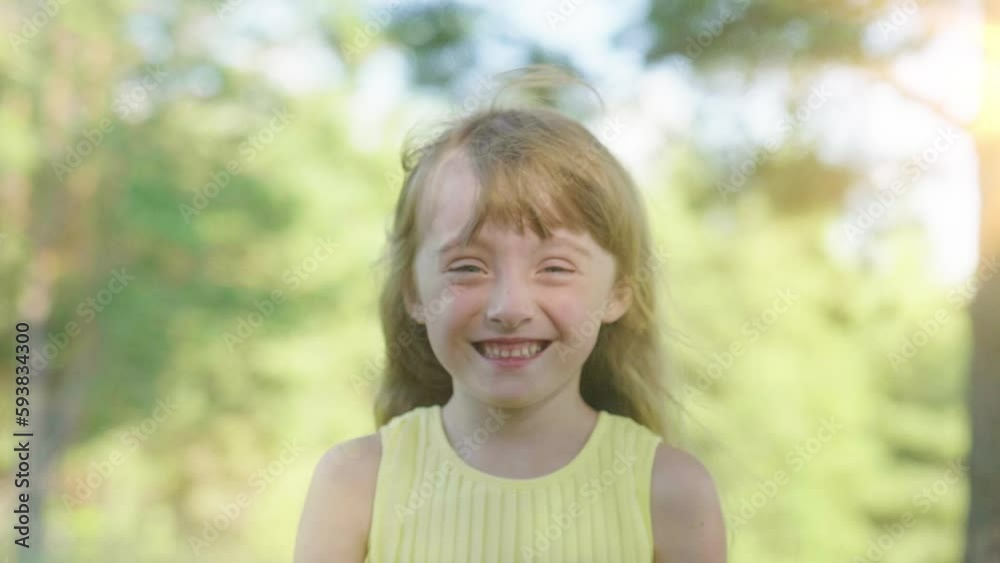 Little Happy Girl Laughs Looking at Camera. Outdoor Portrait Of A Funny Little Child. The Concept of a Carefree Happy Childhood Little Happy Girl Laughs Looking at Camera. Outdoor Portrait Of A Funny Little Child. The Concept of a Carefree Happy Childhood