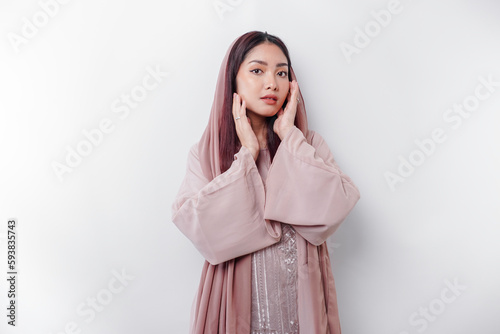 Portrait of a young beautiful Asian Muslim woman wearing a headscarf, beauty shoot concept