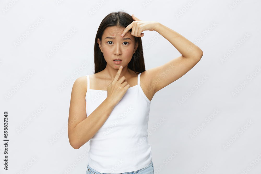 Asian woman facial skin problems, acne and inflammation, red rashes and allergies, chicken pox, sadness from rashes. Facial skin care concept for diseases and nerves Asian woman facial skin problems, acne and inflammation, red rashes and allergies, chicken pox, sadness from rashes. Facial skin care concept for diseases and nerves