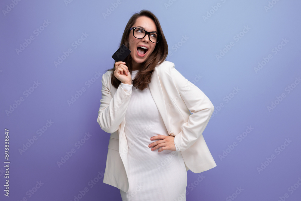 portrait of successful young business woman proudly standing with money card with salary portrait of successful young business woman proudly standing with money card with salary