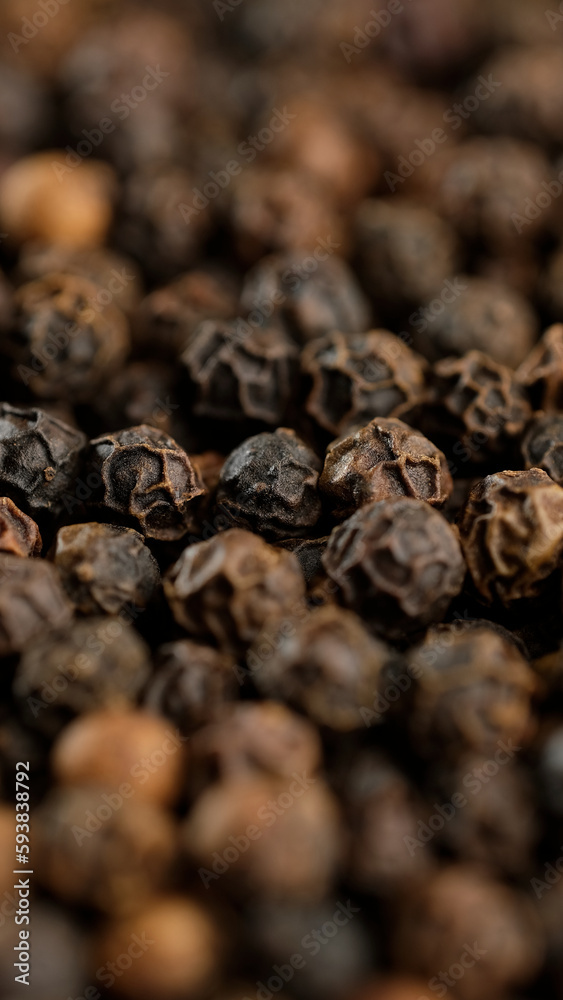 Obraz premium Whole black peppercorns. Dried black peppers. Seasonings and condiments concept