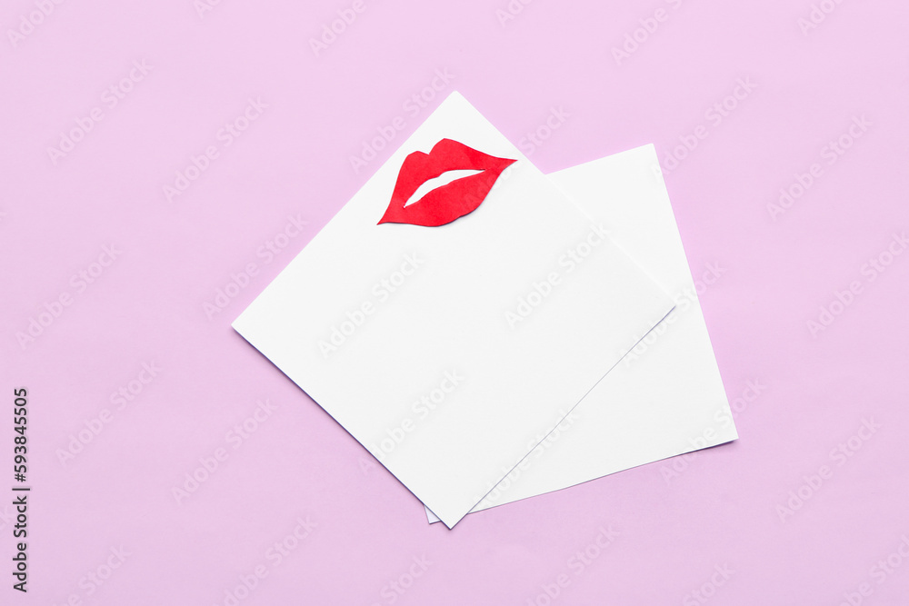 Blank paper sheets with red lips on pink background Blank paper sheets with red lips on pink background