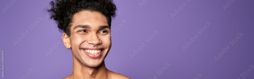Obraz premium Young man model posing and smiling portrait. Transgender adult person lifestyle. Attractive american