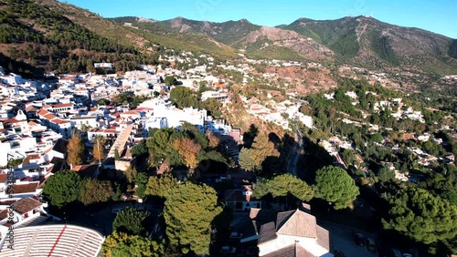 Mijas Pueblo city aerial video with mountains in the background. Beautiful sunny weather, positive frame of beautiful city buildings