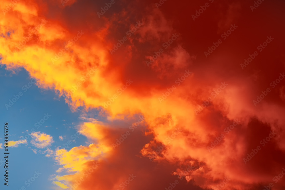 Red vibrant clouds at evening sky 