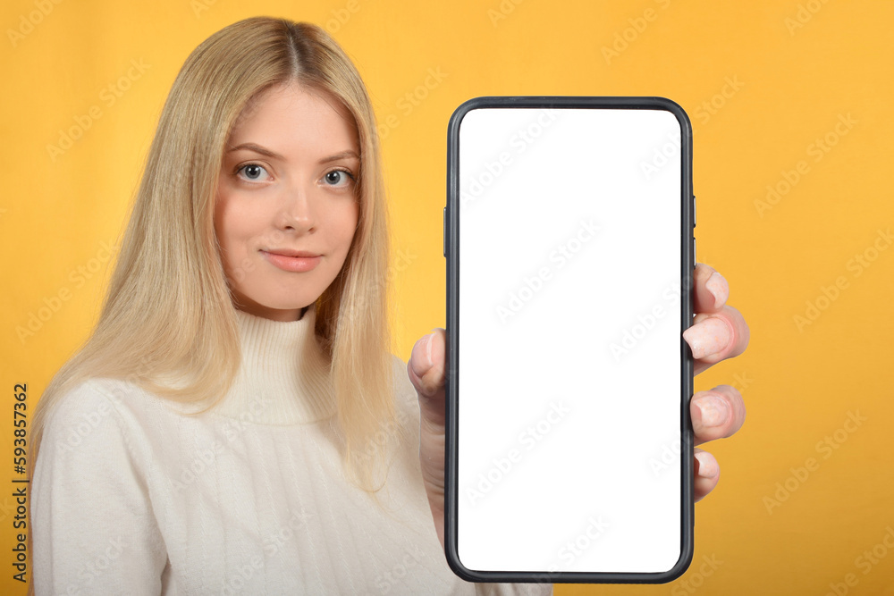 young blonde woman Hold mobile phone with blank empty screen