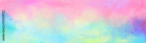Colorful watercolor background of abstract sunset sky with puffy clouds in bright rainbow colors of pink green blue yellow and purple. Abstract painting banner for web and composition