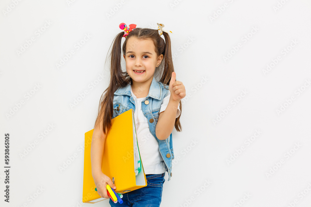 a little girl with a folder and pens a little girl with a folder and pens