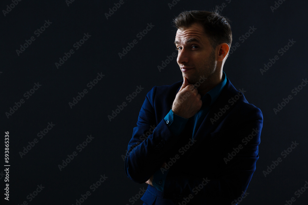 Portrait man in shirt isolated on dark background.