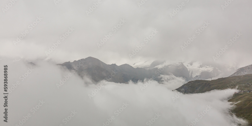 Panorama of cloud layer from mountain top over Swiss alps