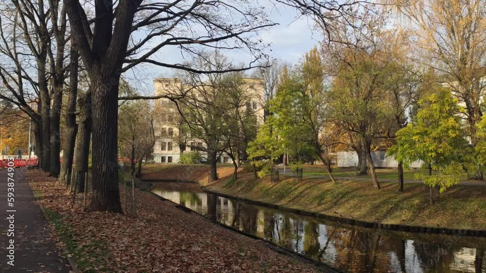 Autumn landscape with a calm pond in Riga, Latvia. Autumn landscape with a calm pond in Riga, Latvia.