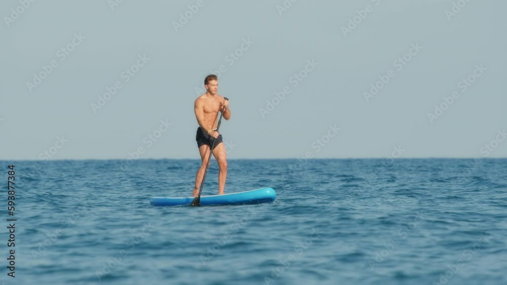 Man navigate with Stand Up Paddle in the sea Man navigate with Stand Up Paddle in the sea