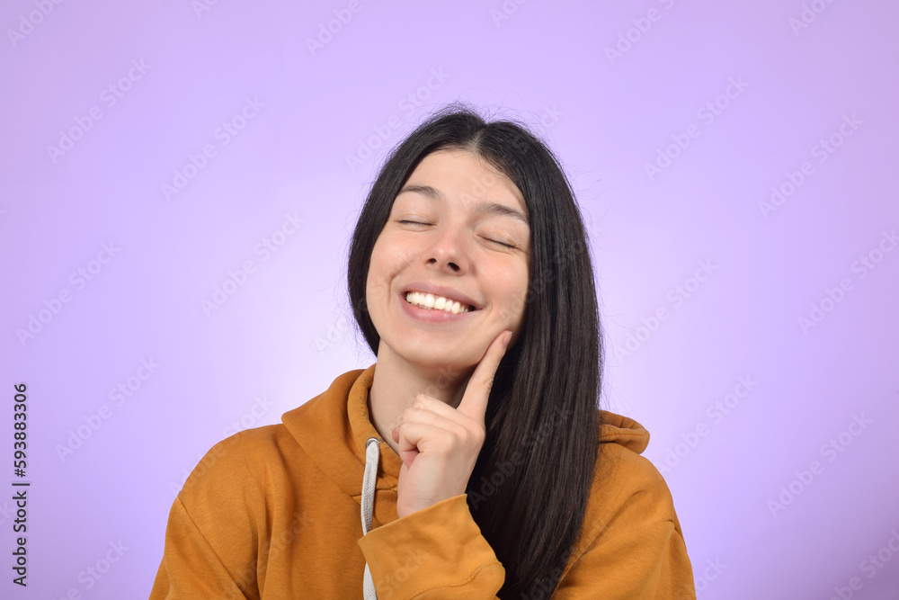 dreamy young woman closed her eyes and smiles dreamy young woman closed her eyes and smiles