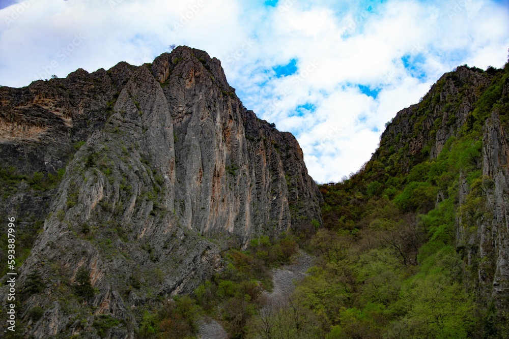 looking up the rock formation of Matka canyon in North Macedonia with cloud sky looking up the rock formation of Matka canyon in North Macedonia with cloud sky