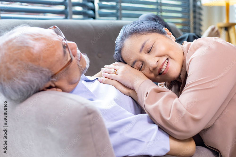 Senior man is suffering from heart attack while his wife is holding his hand for sympathy support and encouragement for compassion and condolence Senior man is suffering from heart attack while his wife is holding his hand for sympathy support and encouragement for compassion and condolence
