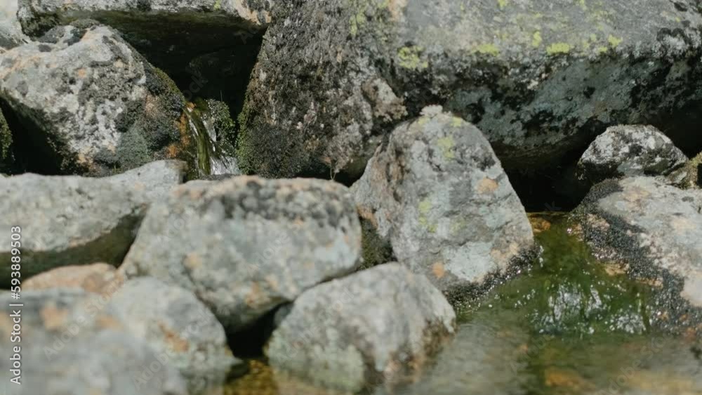 A small waterfall. Clear mountain water flows slowly between the mossy stones. Norway A small waterfall. Clear mountain water flows slowly between the mossy stones. Norway