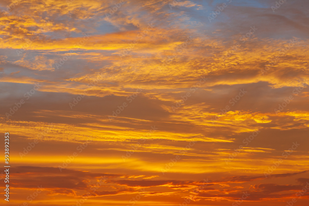 Nature's Canvas: A Stunning Sunset Sky of Orange, Red, and Blue, Illuminating the Evening Cloudscape