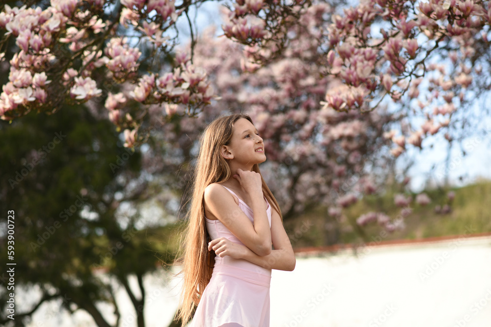 portrait of a woman in the park. Blooming trees