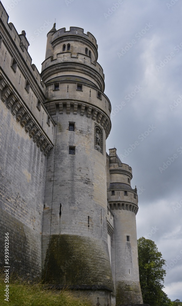 Side view of Chateau de Pierrefonds Castle towers in Pierrefonds, Oise, France with blue sky