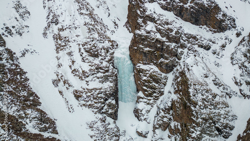 Frozen waterfall in Kyrgyzstan. Shamsi Gorge photo