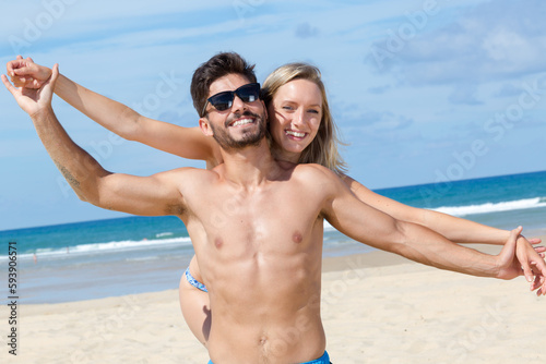 young happy couple on the beach