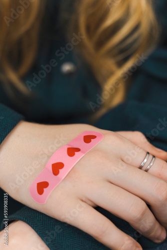 the girl's hand is sealed with a band-aid
