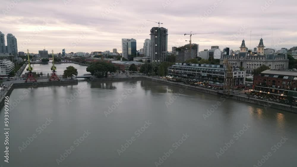 Aerial Cityscape of Buenos Aires City Argentina in Puerto Madero, microcentro during sunset with commercial port and crane Aerial Cityscape of Buenos Aires City Argentina in Puerto Madero, microcentro during sunset with commercial port and crane