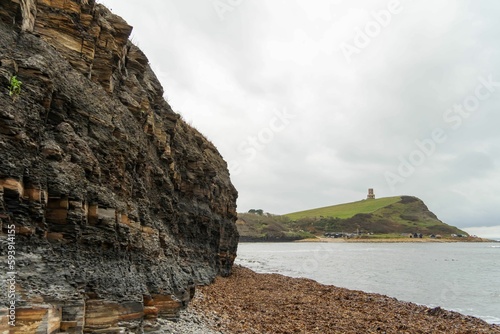 The coastal view at Kimmeridge Bay, Dorset, UK, showing the layers of oil shale, mudstone, limestone photo