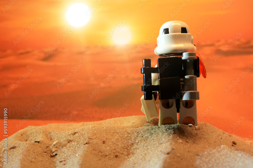 Naklejka premium Lego Star Wars figure Sandtrooper looks to the two suns of the desert planet Tatooine