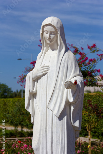 The statue of the Queen of Peace near the St James Church in Medjugorje, Bosnia and Herzegovina. 2016/08/20.