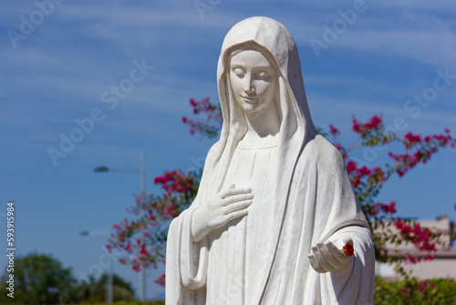The statue of the Queen of Peace near the St James Church in Medjugorje, Bosnia and Herzegovina. 2016/08/20. photo