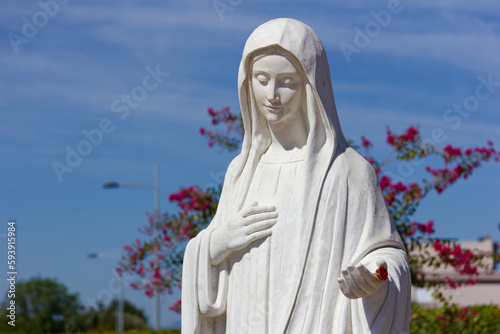 The statue of the Queen of Peace near the St James Church in Medjugorje, Bosnia and Herzegovina. 2016/08/20.