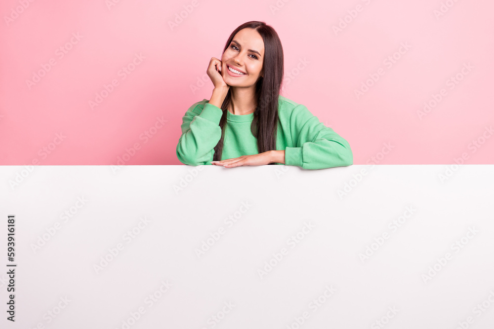 Photo of adorable gorgeous woman with straight hairdo dressed green sweatshirt hold hand under chin isolated on pink color background Photo of adorable gorgeous woman with straight hairdo dressed green sweatshirt hold hand under chin isolated on pink color background