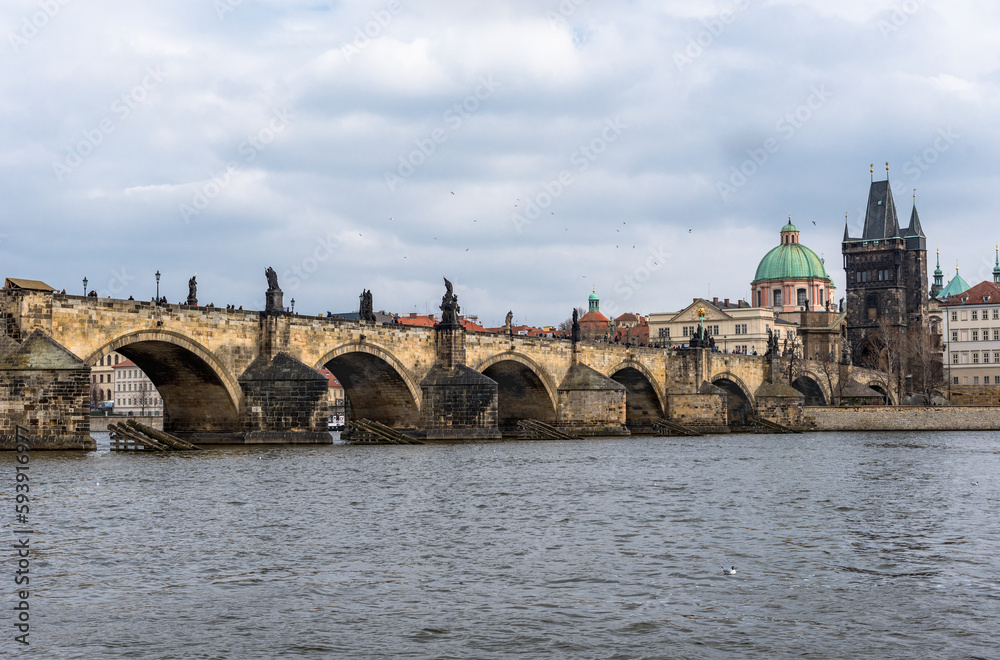 River Vltava in Prague, Czech. Charles Bridge and Old Town Water Tower in Background