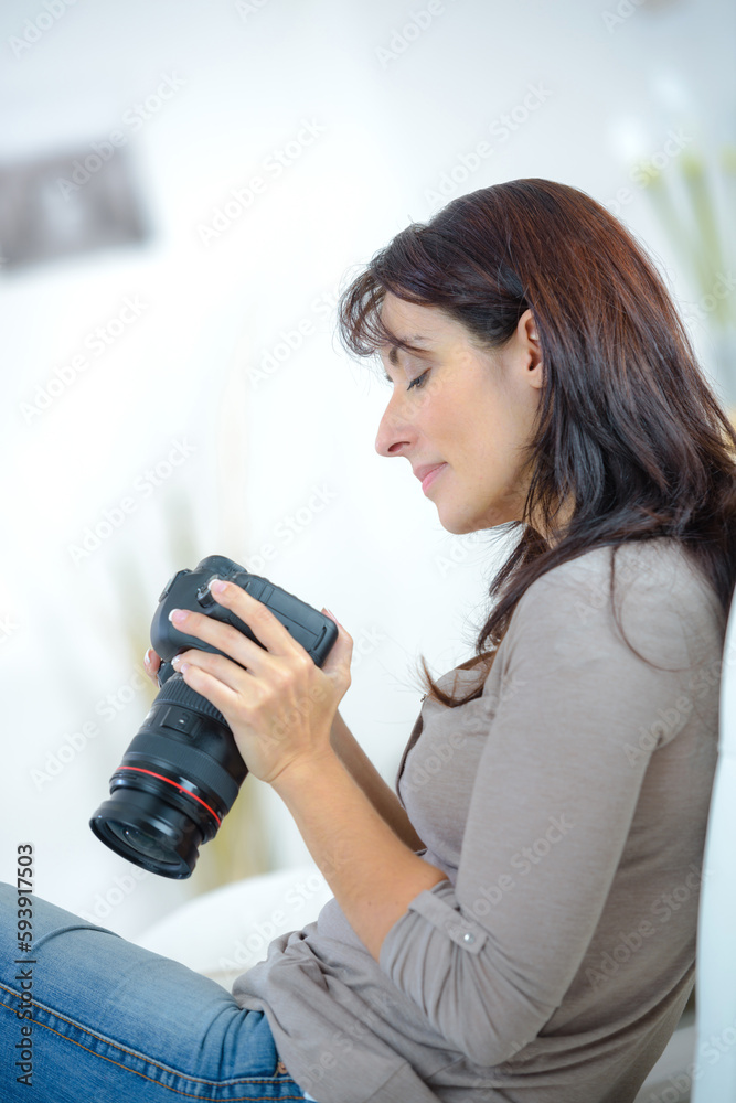 woman photographer is taking images with dslr camera