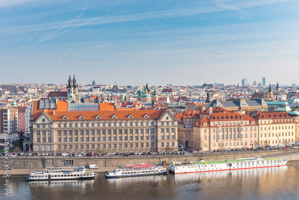 Cityscape of Prague, Czech. Vltava river and barge. Colorful Architecture.