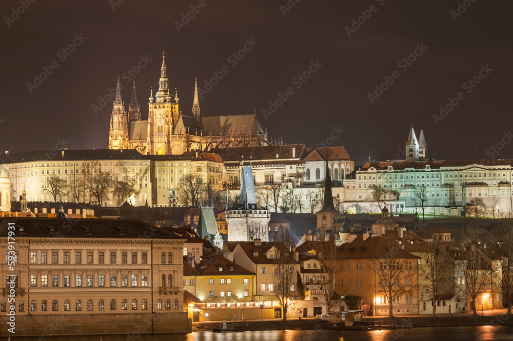 Night Cityscape of Prague, Czech. St. Vitus Cathedral, Castle and Palace in Background. Vltava river. Long Exposure. Prague, Czech Republic