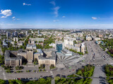 Aerial wide panorama view on Karazin National University northern building on Freedom square with green park and blue sky in spring Kharkiv city, Ukraine