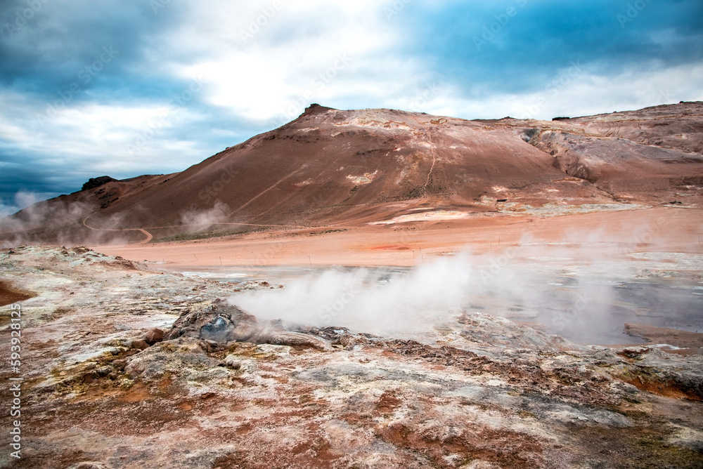 Magical dramatic scene with geothermal swamp and volcanoes in Hverir (Hverarond) valley in the Myvatn region. Iceland. Exotic countries. Amazing places.